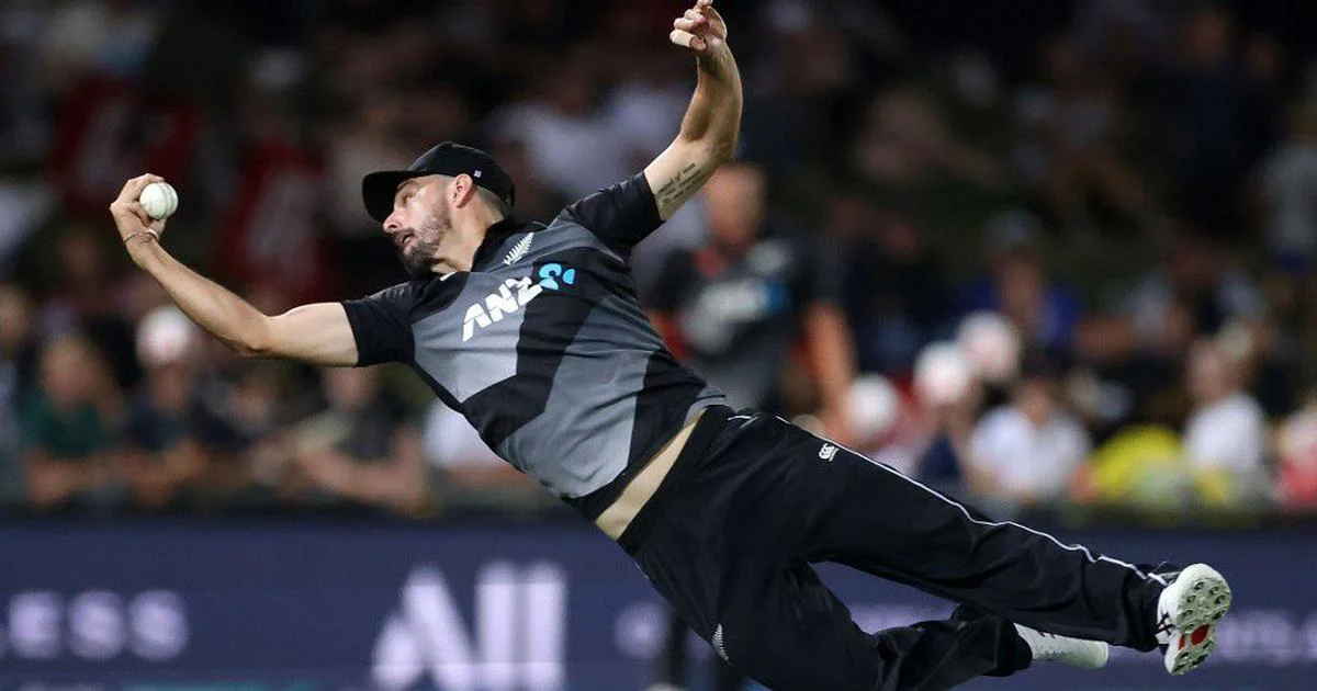 Substitute fielder taking a brilliant catch near the boundary