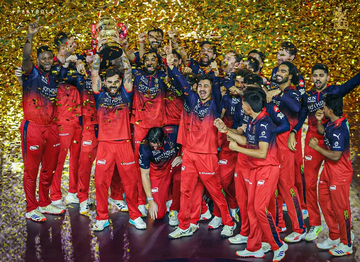 Virat Kohli lifting the IPL 2026 trophy after RCB's back-to-back championship win