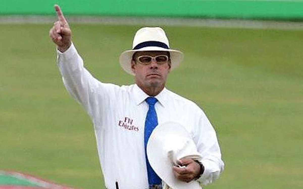 Cricket umpire making a tough out decision on the field